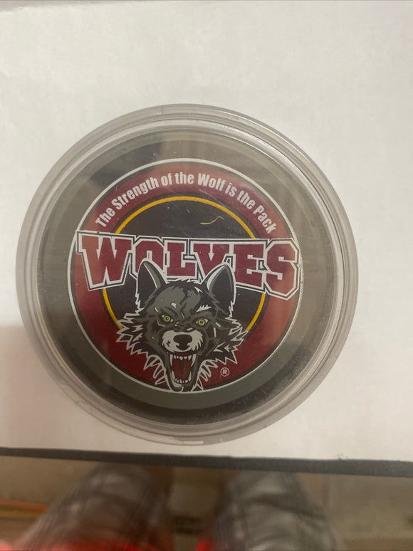Chicago wolves hockey puck in case